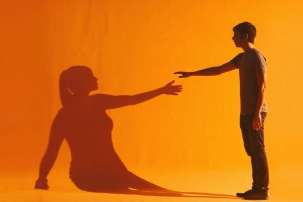 Illustration of a person letting go of memories, symbolizing steps to heal and move forward after a breakup