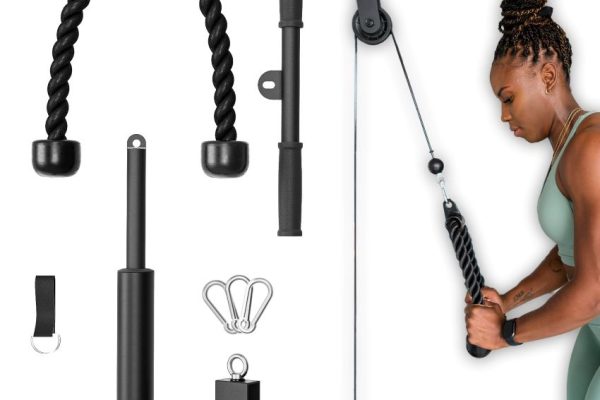 Stainless steel cable pulley wheels installed on gym equipment.