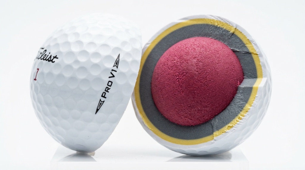 Close-up macro view of a golf ball's internal layers and dimple design for technical review.