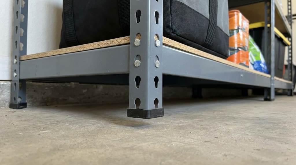 Heavy storage bins evenly distributed on garage shelving